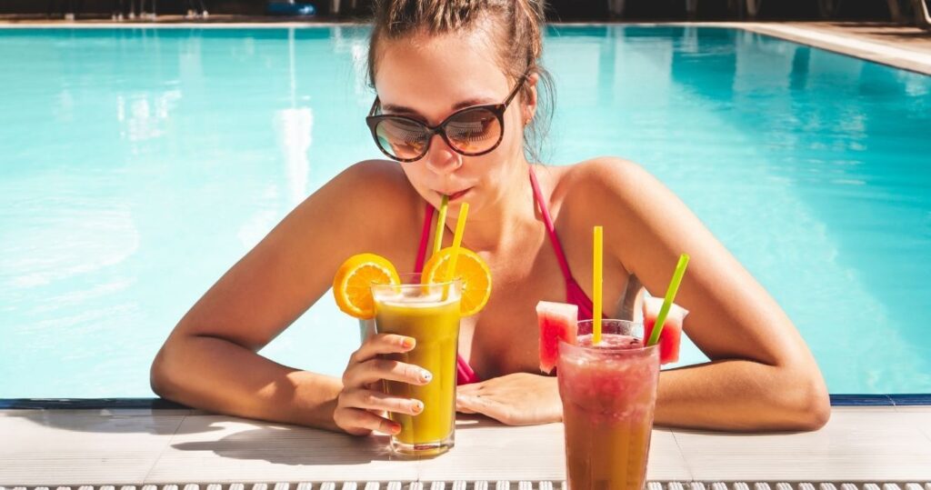 a guests drinking in a pool at an all-inclusive resort